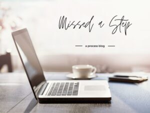 image of a laptop and coffee on a table - process blog of author Jackie Keswick